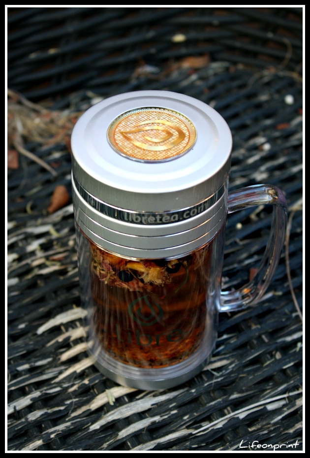 Libre tea mug with hot tea in it. 