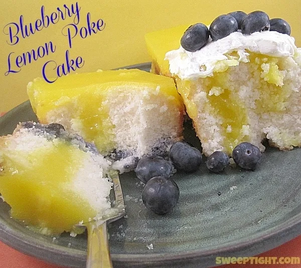 Lemon blueberry poke cake on a plate. 