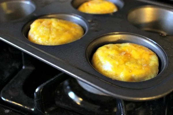 Hasbrown casserole and eggs in a muffin tin. 