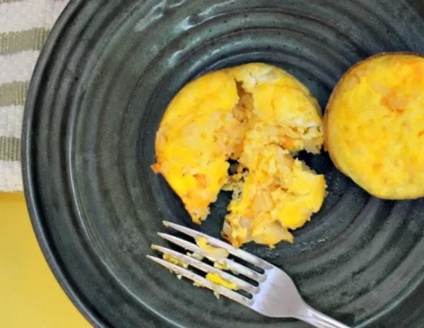 Hashbrown casserole in eggs on a plate. 