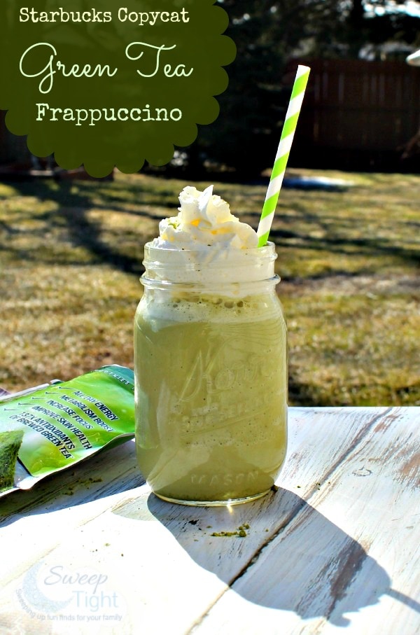 Green tea frappuccino in mason jar next to a package of matcha powder. 