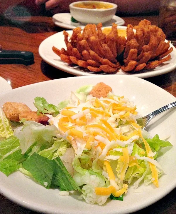 Salad and blooming onion at Outback Steakhouse. 
