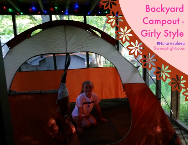 A tent in a porch with twinkle lights. 