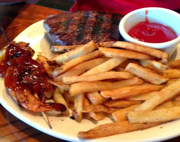 Sirloin, shrimp, and fries at Outback. 