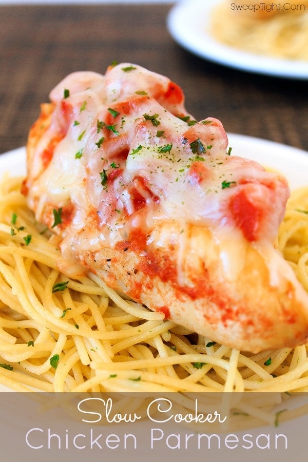 Chicken parmesan on top of pasta. 