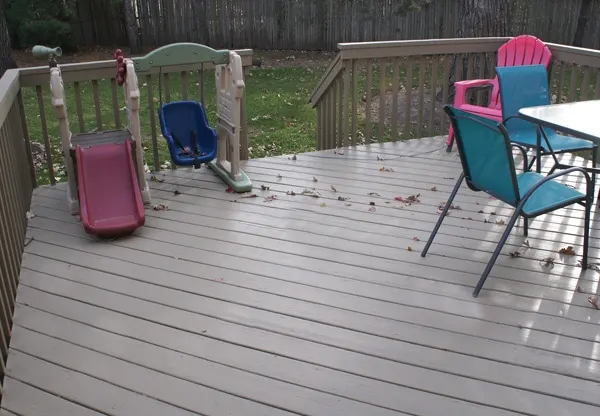 Painted deck with toys and chairs. 
