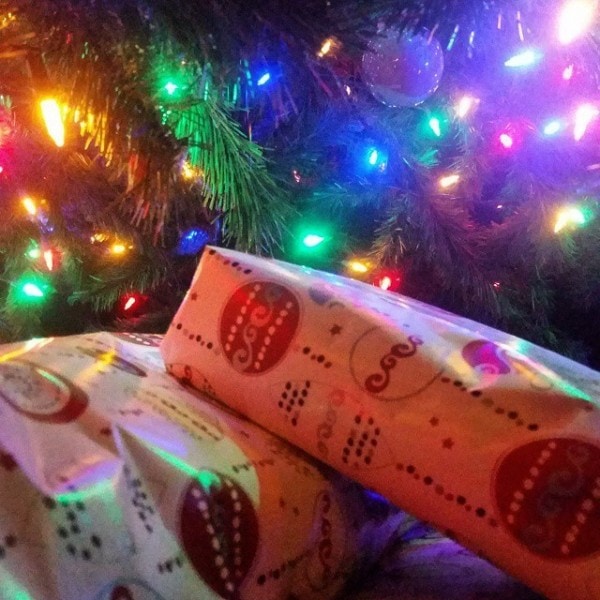 Wrapped gifts under a Christmas tree. 