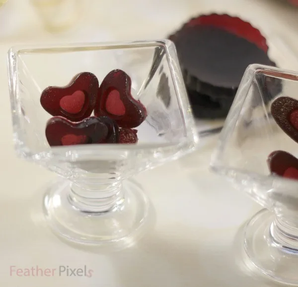Red wine gummies in various shapes and sizes