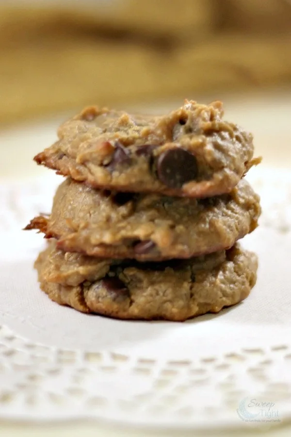 Three cookies stacked on a plate. 