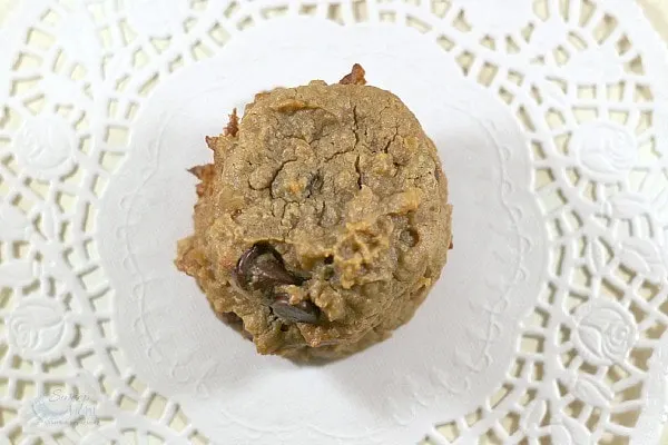 Overhead image of peanut butter chip cookies on a doily. 