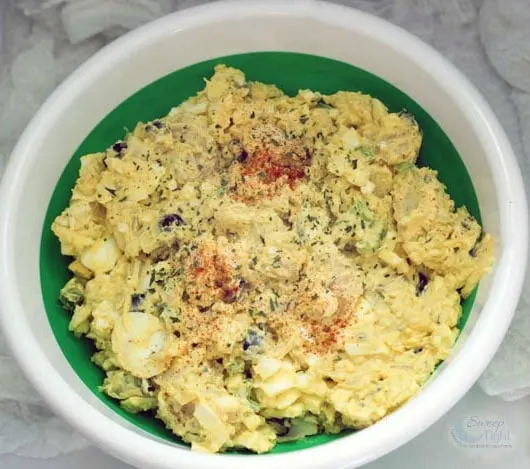Potato salad with eggs in a green Pampered Chef bowl. 