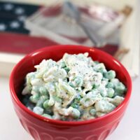 pea salad in a red bowl