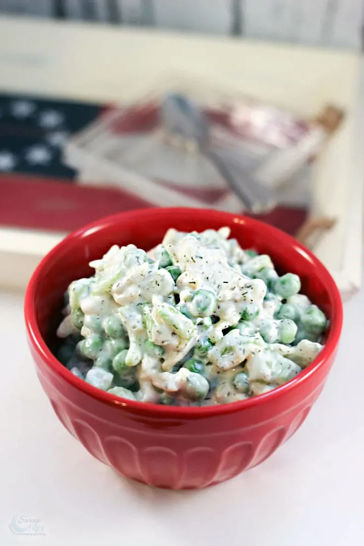 pea salad in a red bowl