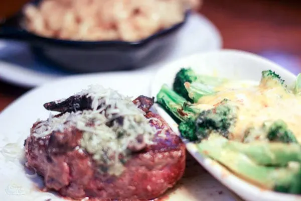 Steak and broccoli topped with cheese at Outback. 