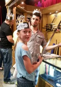 Evan and Chesney at Medieval times looking at swords. 