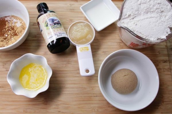 Butter, vanilla, applesauce, brown sugar, and flour in bowls.