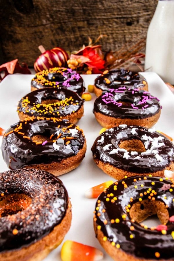 Rows of donuts decorated for Halloween.