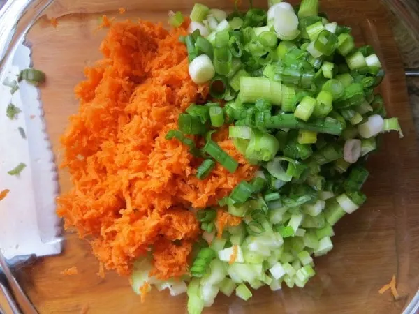 Chopped carrots, onions, and celery in a bowl. 