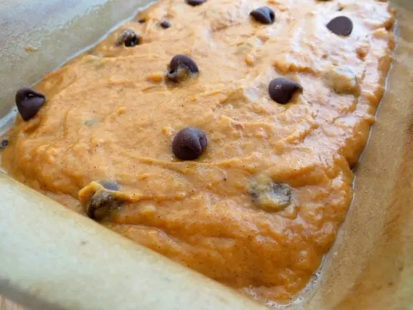 Chocolate chip pumpkin bread batter in a loaf pan. 