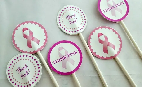 Pink ribbon cupcake toppers on sticks. 