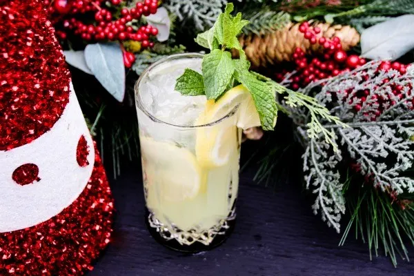 Lemonade drink next to holiday decorations.