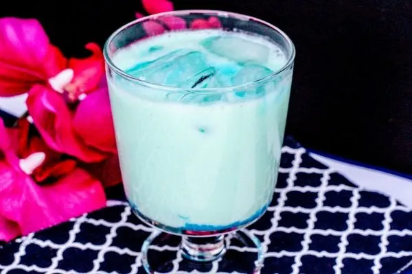 Blue cocktail mixed in a glass with ice