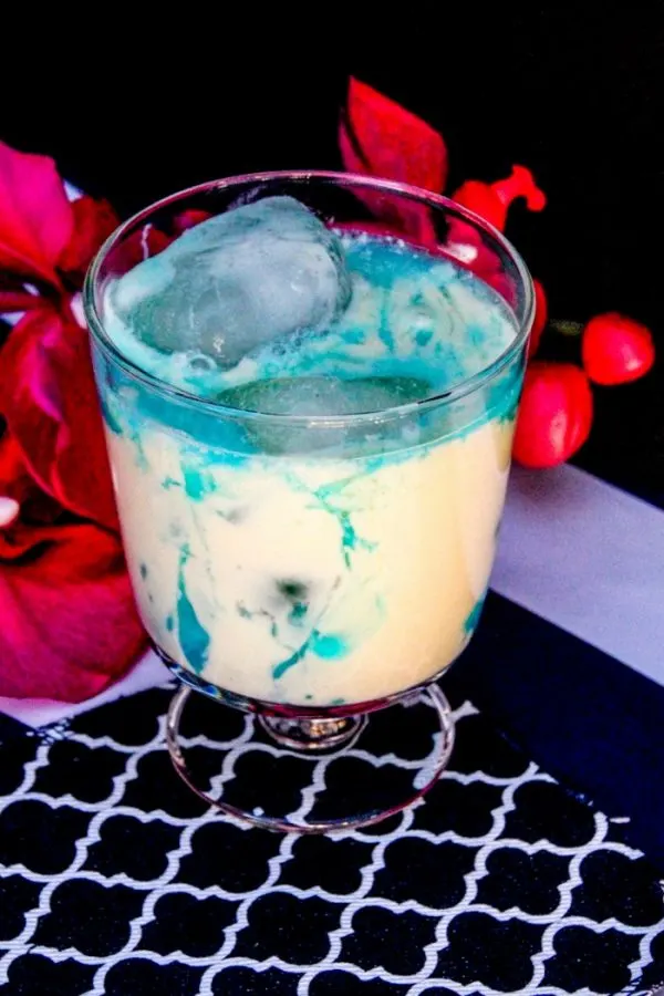 Creamy cocktail with blue swirls