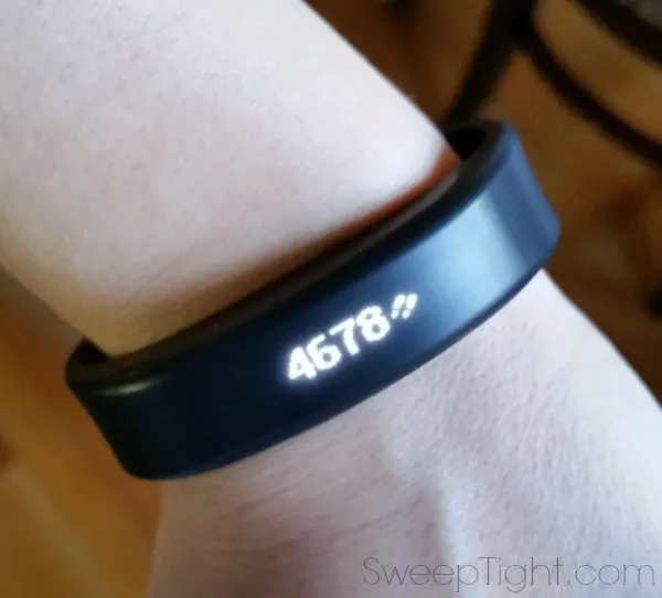 A Garmin fitness tracker with 4678 on it. 