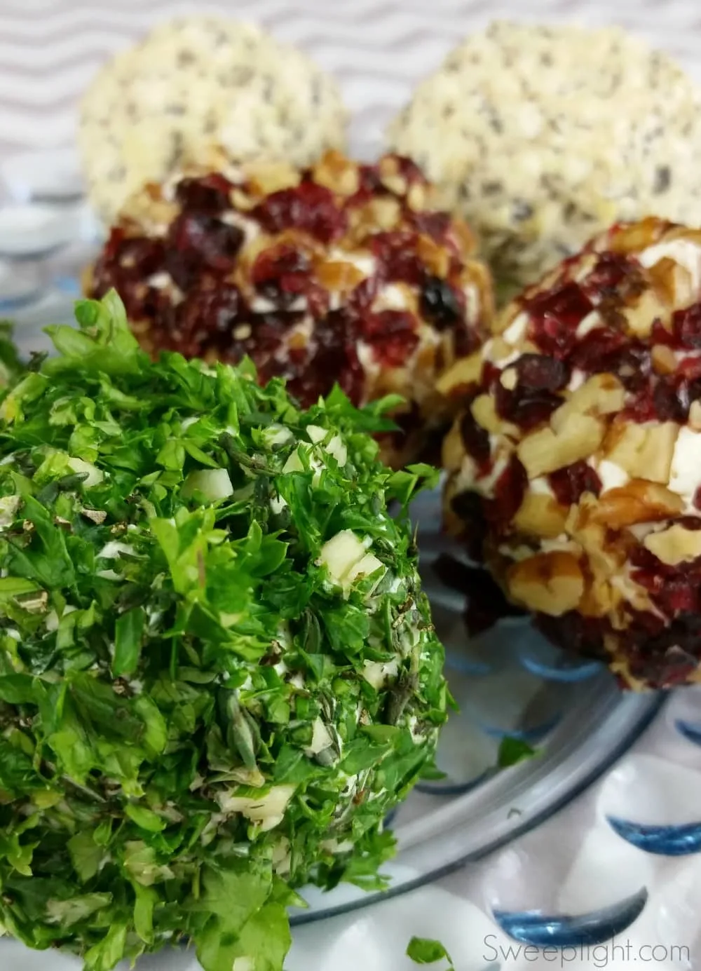 Savory Mini Cheese balls on a clear plate. 