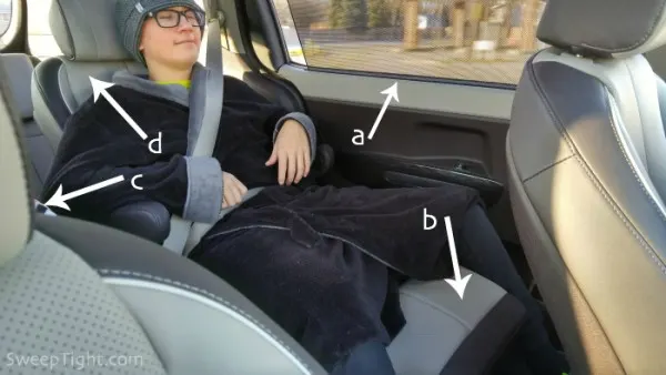 Adam in the 2016 Kia Sedona backseat. 