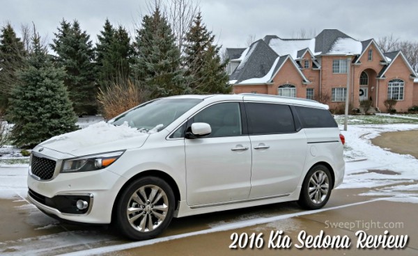2016 Kia Sedona in a driveway with snow outside. 