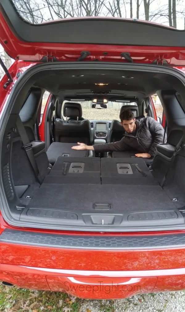 Evan displaying the seating of the 2015 Dodge Durango. 