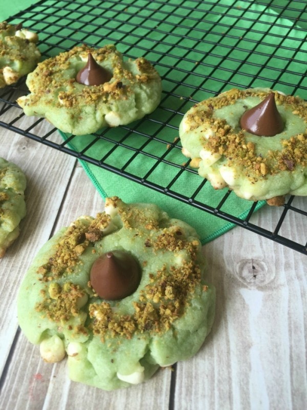 Green pistachio kiss cookies with white chocolate chips. 