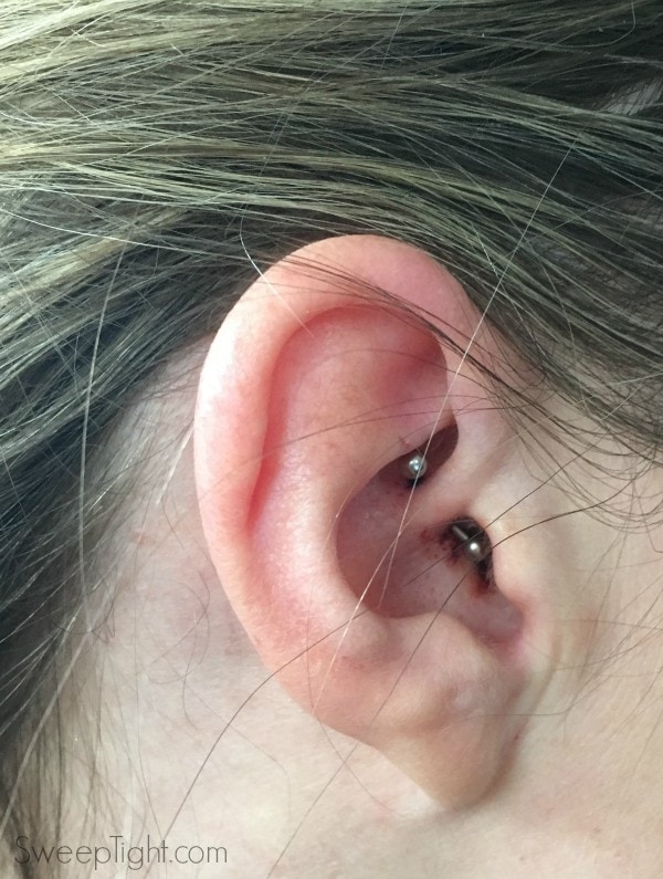 Ear with a daith piercing for migraines