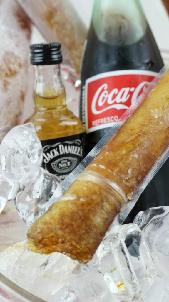 Jack and Coke in a bowl with frozen pops and ice cubes