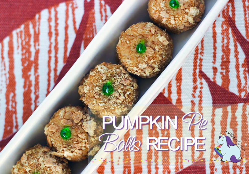 Pumpkin OREO balls lined up in a tray. 