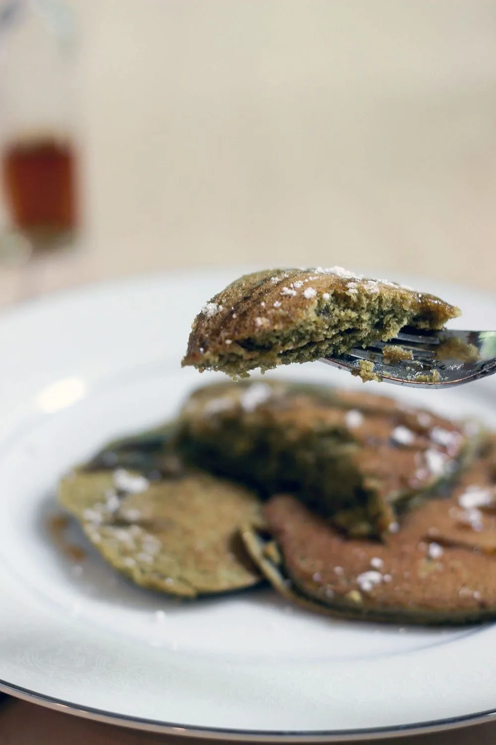 Fork full of green tea pancakes