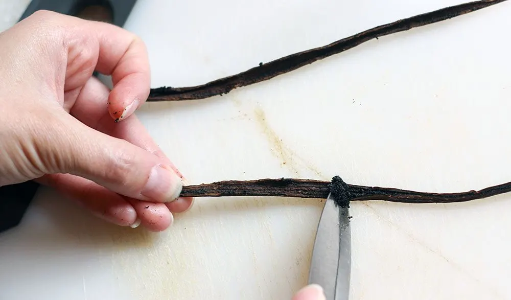 Vanilla bean - scraping the beans out of the fresh vanilla bean