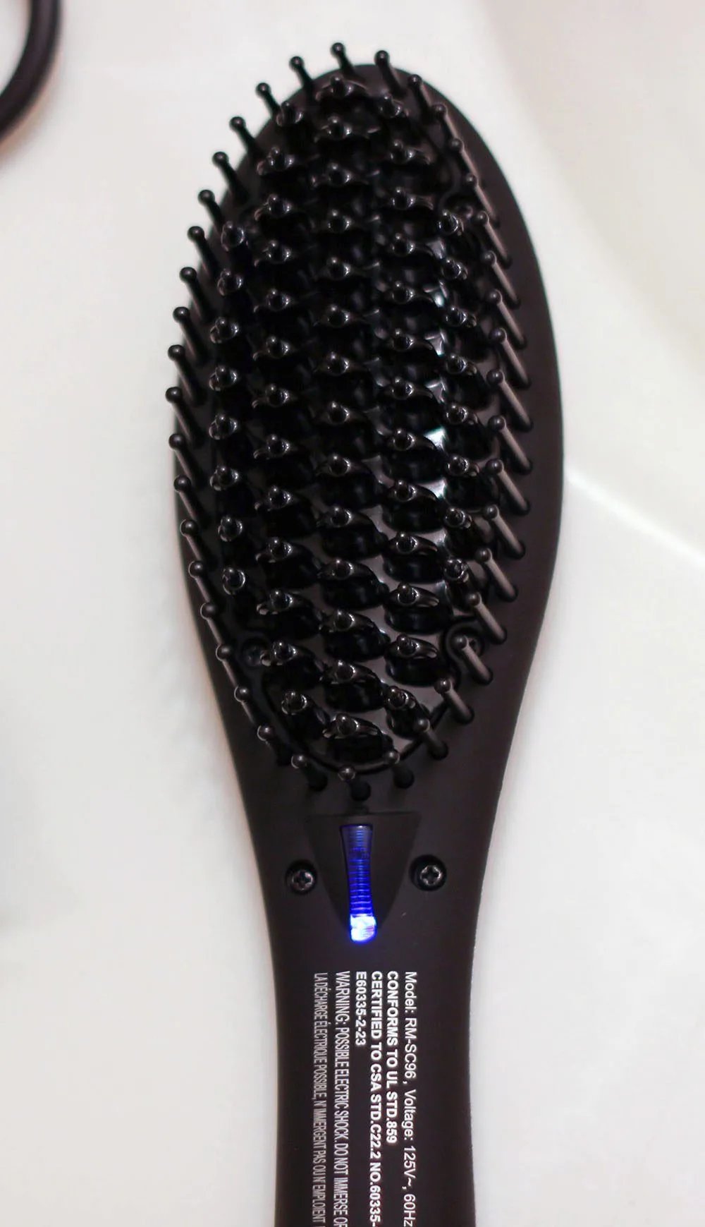 Heated hair brush for straightening and smoothing hair