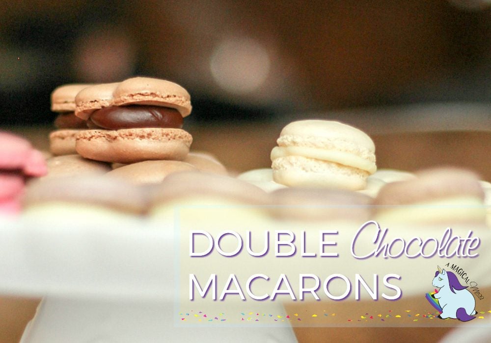 Chocolate and vanilla macarons on a tray. 