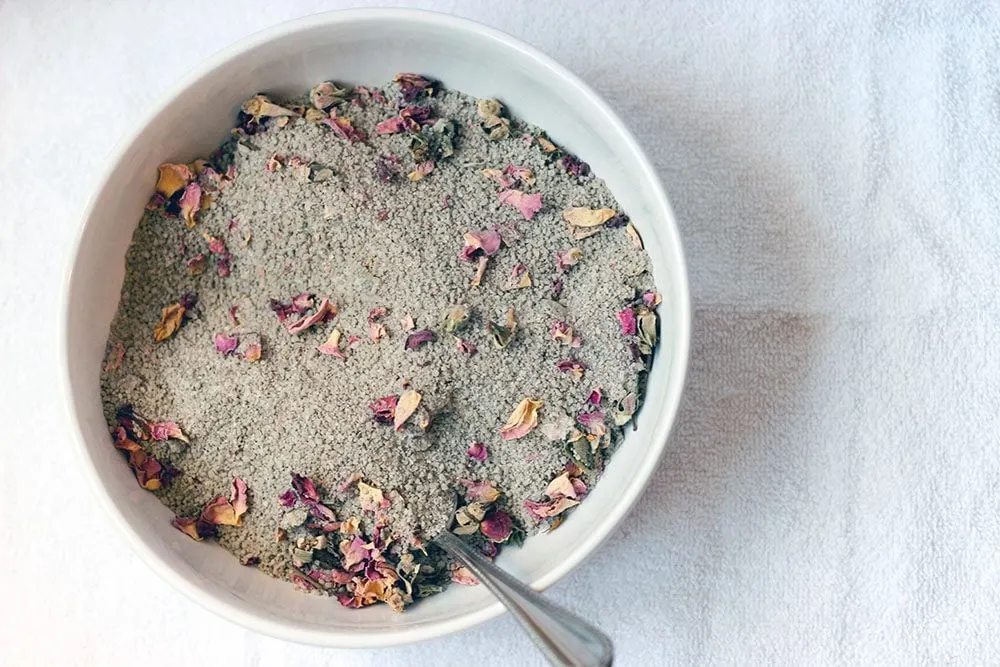 Rose bath soak mixed in a bowl.