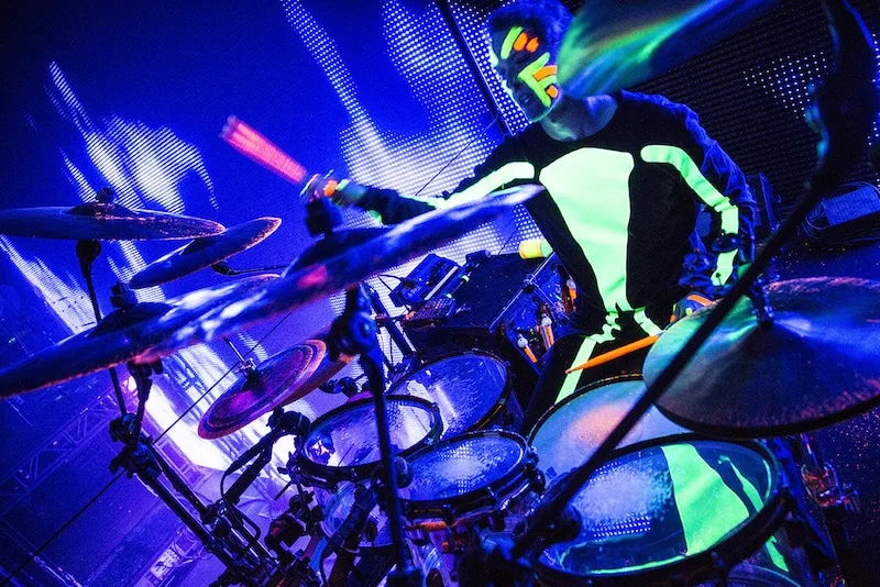 Blue man on the drums. 