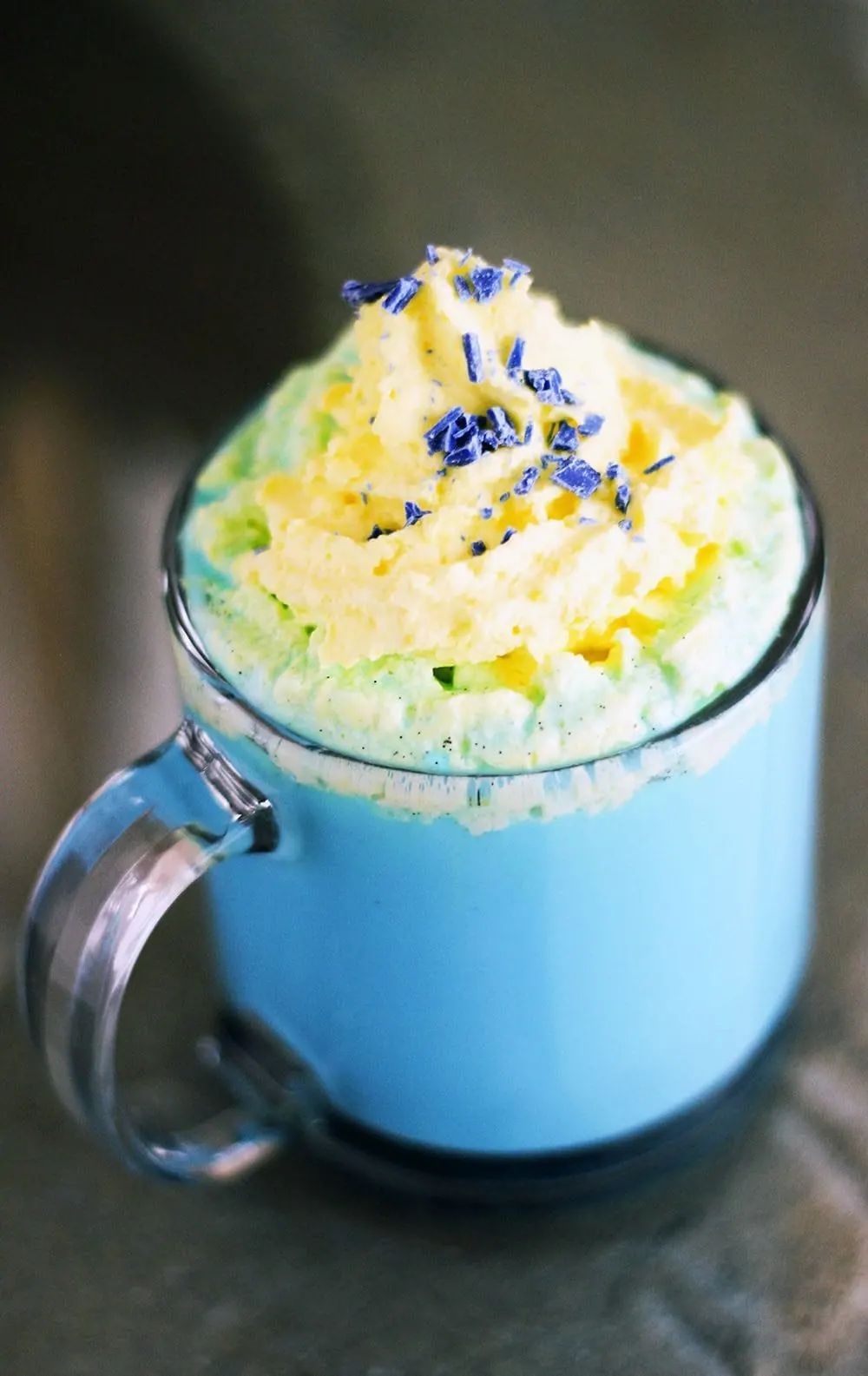 Vanilla Smurfette Blue Drink topped with yellow whipped cream. 