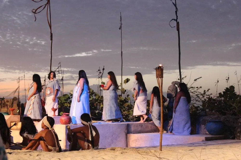 Pregnant women walking onto stage for a ritual during The Sacred Mayan Journey.