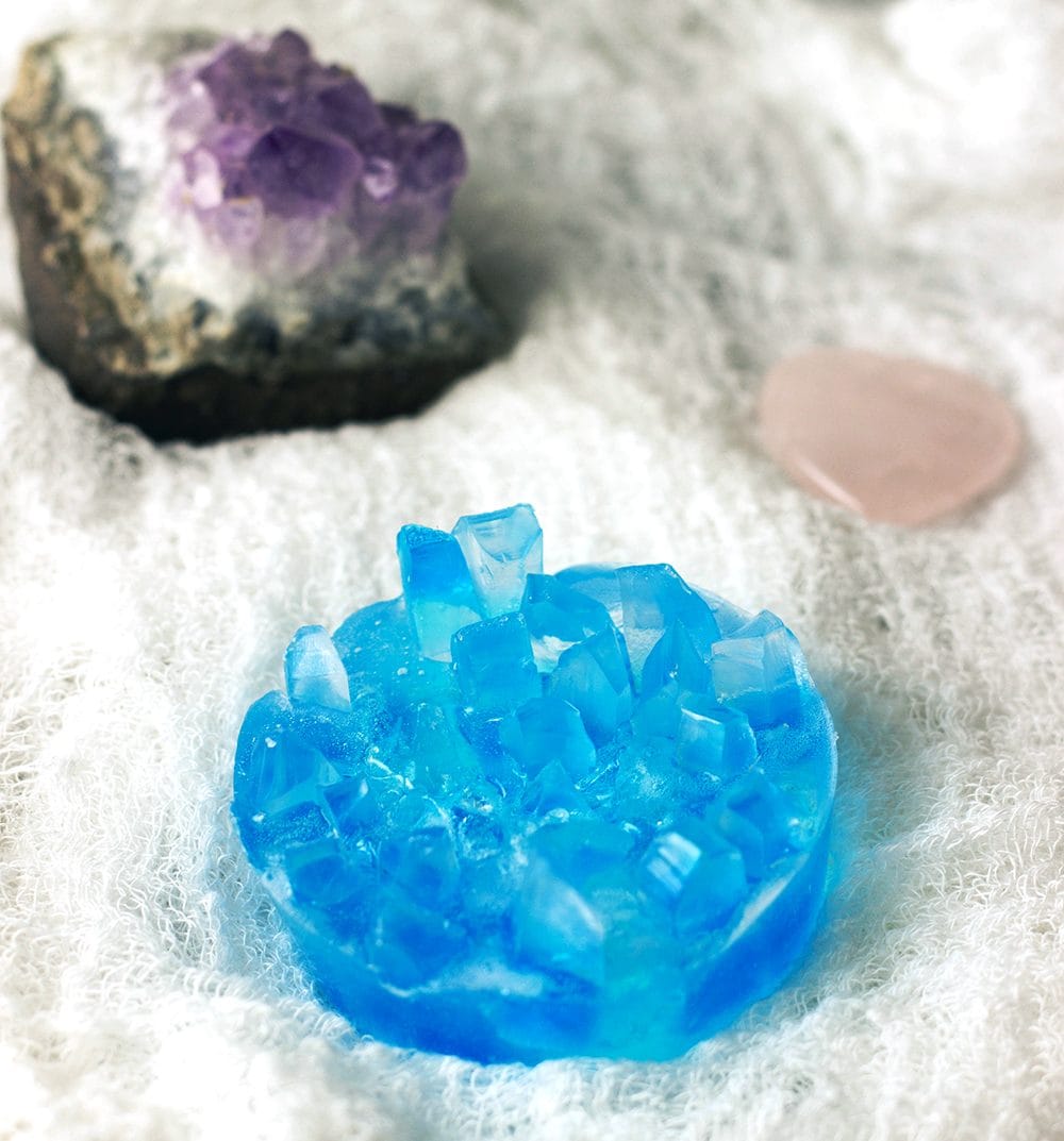 Crystal soap next to real stones.