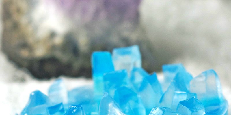 Crystal soap with an stone in the background.