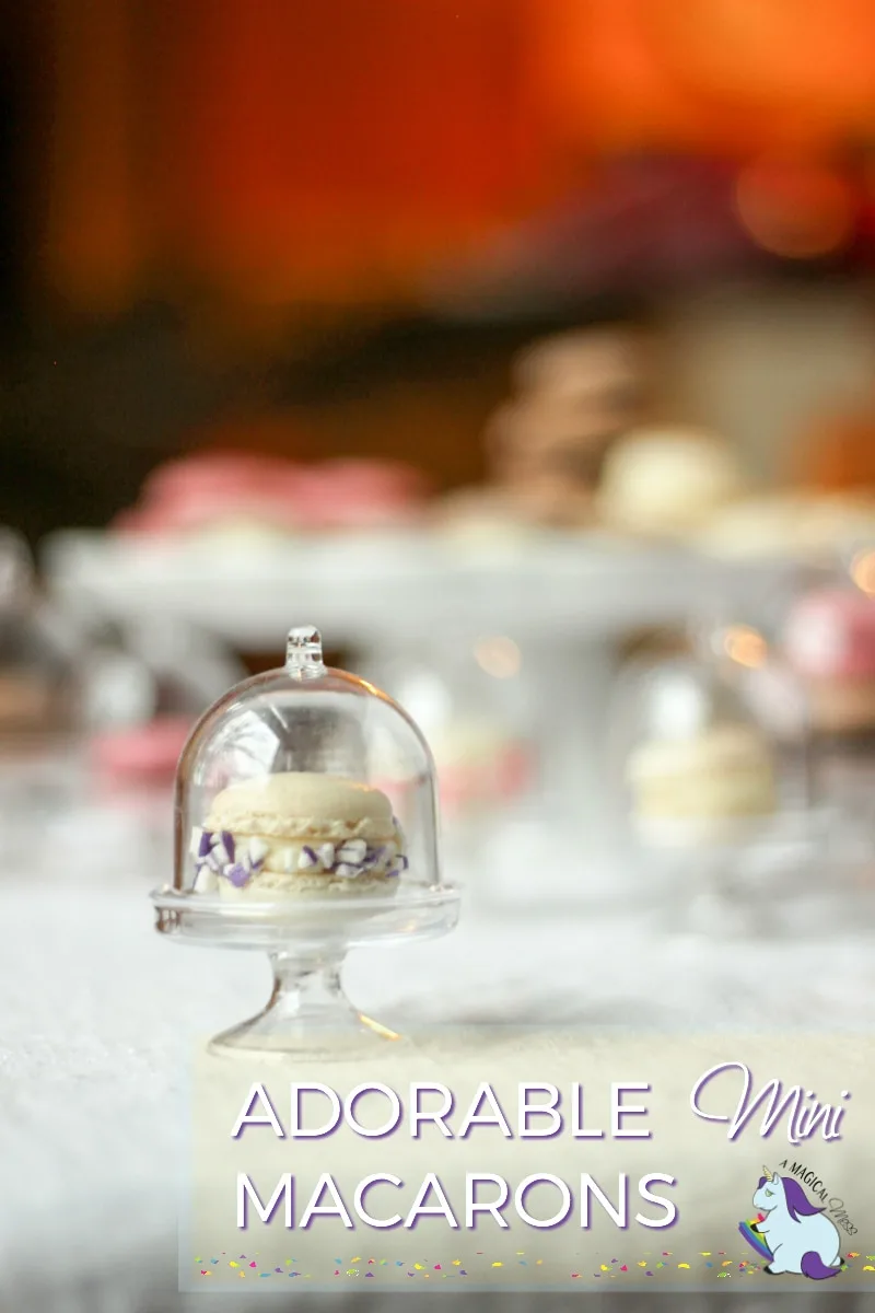 Tiny French Macarons on mini cake stands. 