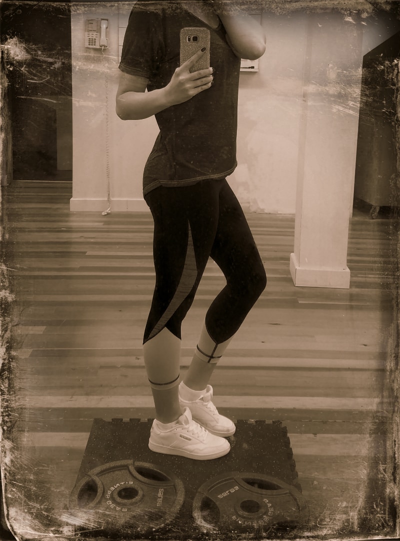 Shelley wearing Reebok Classic shoes in the gym. 