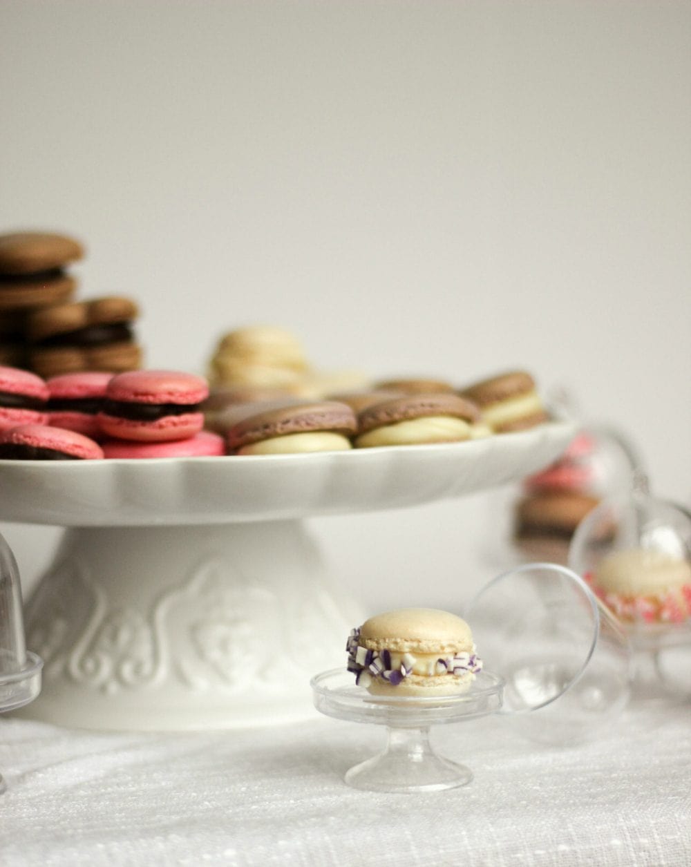 Mini French Macarons on cute stands.