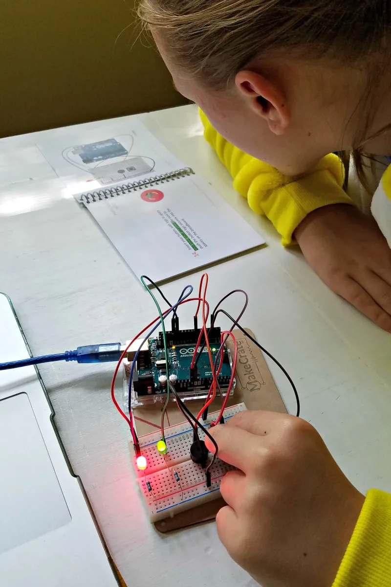 A teen building a Make Crate project. 